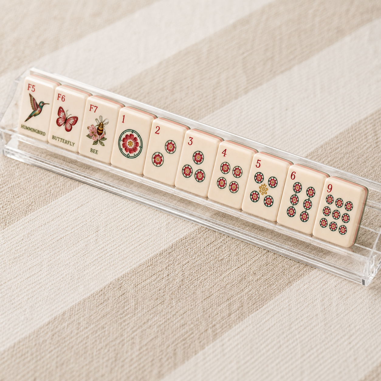 Blue Porcelain Mahjong tiles displayed on a rack