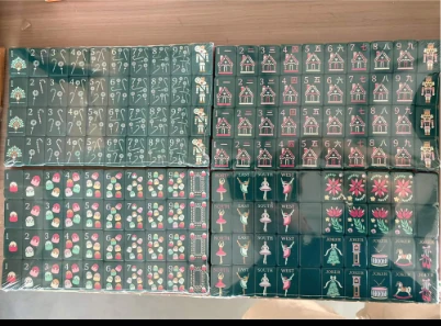Dark green Mahjong tile set with illustrated faces