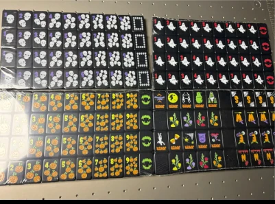 Black Mahjong tiles with contrasting illustrated designs